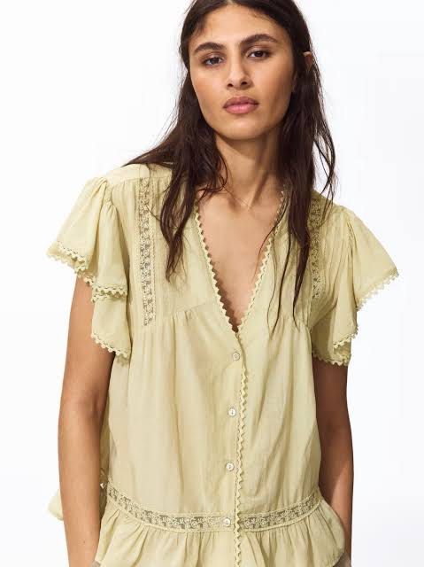 H&M Sage Green Lace Trim Button-Up Blouse (Category: Blouses) located in Manila. Submitted by gabwie (Listing ID 1468407956, Image 1). Description: - Brand: H&M - Size: L - Bought for 1490 - Color: Sage green - Material: Lightweight cotton - Style: Button-up peplum with V-neckline - Details: Delicate lace trim on the neckline, front panel, hem, and layered flutter sleeves - Condition: Great overall condition - NEVER WORN.
