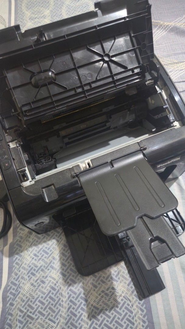 HP LaserJet P1102w Printer (Category: Printers, Scanners & Copiers) located in Cavite. Submitted by tepidelarosa (Listing ID 1468352335, Image 2). Description: - Model: HP LaserJet P1102w Wireless Laser Printer - Finish: Sleek black with a compact, space-saving footprint - Condition: Powers on perfectly and prints crisp text documents - Features: Fold-out tray extensions for easy paper loading - Inclusions: Toner cartridge already installed insid