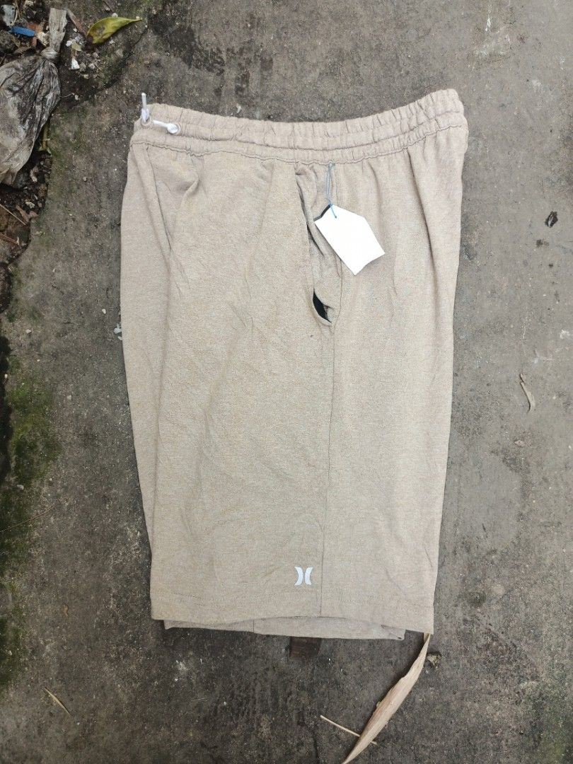 Hurley beige drawstring shorts (Category: Shorts) located in Manila. Submitted by vastdolphin.8d68cc (Listing ID 1468324485, Image 2). Description: - Brand: Hurley - Color: Beige - Condition: Brand new with original tags attached - Material: Lightweight and comfortable fabric - Features: Elastic waistband with drawstring, small logo near the hem, and back pocket with Hurley tag - Best for: Casual wear, lounging, or beach trips.