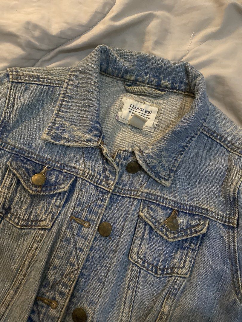 I Love H81 Light Wash Denim Jacket Size S (Category: Coats, Jackets and Outerwear) located in Manila. Submitted by newkkmora98454 (Listing ID 1468314989, Image 1). Description: - Brand: I Love H81 - Size: Small (Tag reads 160/84A) - Wash: Light wash denim - Design: Classic button-up front with metal hardware - Pockets: Dual chest pockets and convenient side welt pockets - Details: Trendy distressed accents on the collar and hems - Origin: Made in