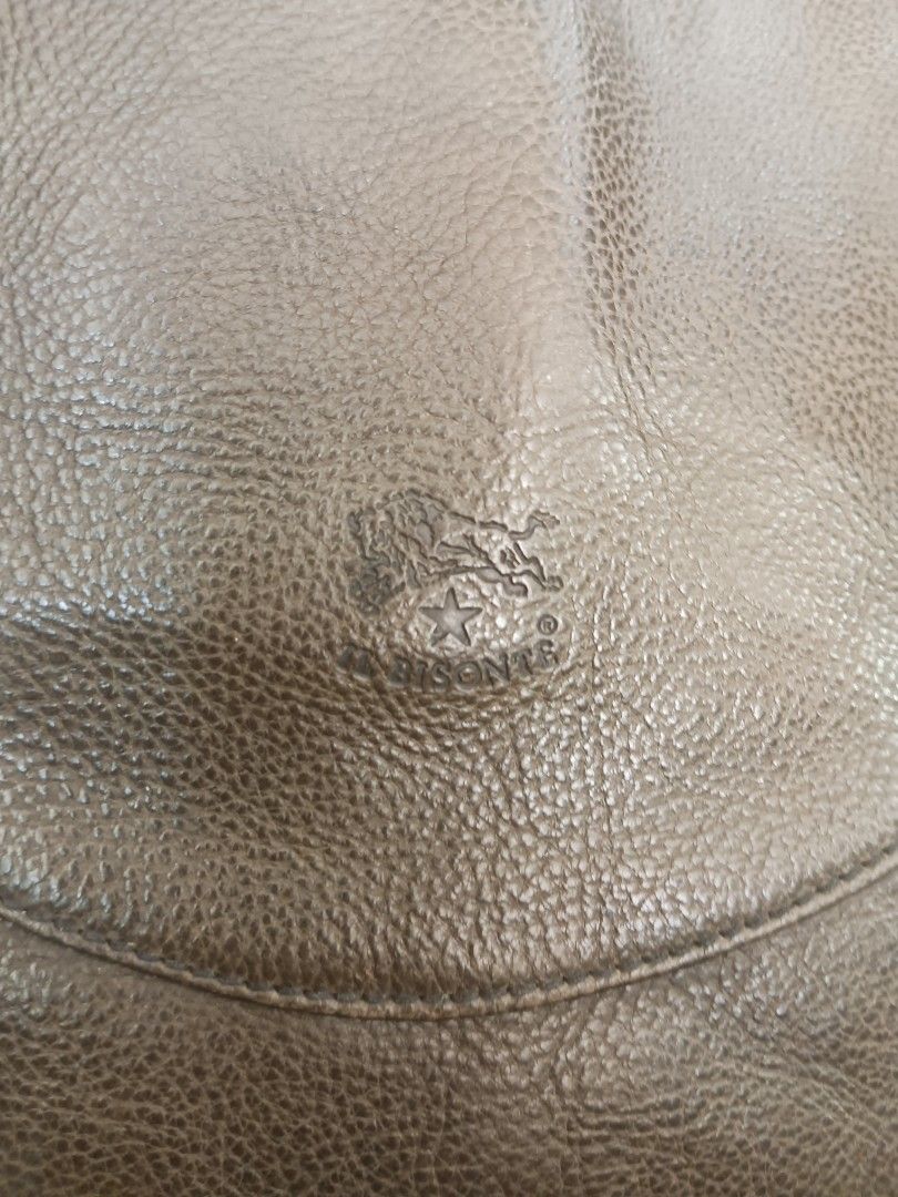 Il Bisonte Leather Hobo Shoulder Bag Olive Green (Category: Luxury Bags & Wallets) located in Quezon City. Submitted by arvietekto (Listing ID 1468363479, Image 3). Description: - Authentic Il Bisonte shoulder bag crafted in Italy by W.A. di Filippo - Premium genuine textured leather in a versatile olive green shade - Sturdy top handle and secure zip closure for daily use - Dark fabric-lined interior complete with a convenient slip pocket - Signa
