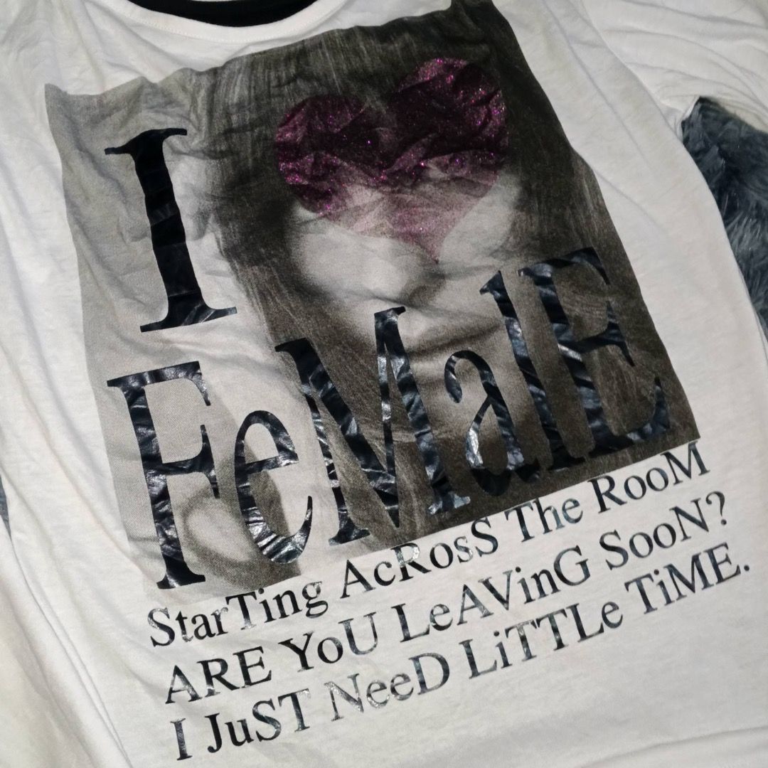 In The Attic (Category: Longsleeves) located in Caloocan City. Submitted by whirshie (Listing ID 1468316884, Image 3). Description: - Brand: In The Attic - Size: L -Measurements: Width -19 Length- 27 - Color: White and black - Design: Layered look with front text ('I FeMaLe' and lyrics) and back text ('SHINE ON YOUR CRAZY DIAMOND') - Material: Comfortable cotton - Authentic detail: Japanese tag attached inside.