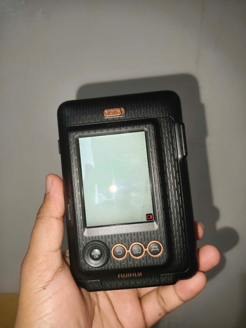Instax Mini LiPlay FujiFilm (Category: Cameras) located in Quezon City. Submitted by creamymatchaaaaonlyyyy (Listing ID 1468399652, Image 3). Description: Good as new , nakatambak nalang honest issue gasgas lang ,di nakakaaffect sa pics * Take photos and print them instantly using Instax Mini film. * Print photos from your phone through Bluetooth. * Add sound to photos by recording audio and printing a QR code on the photo. * Choose your favorite