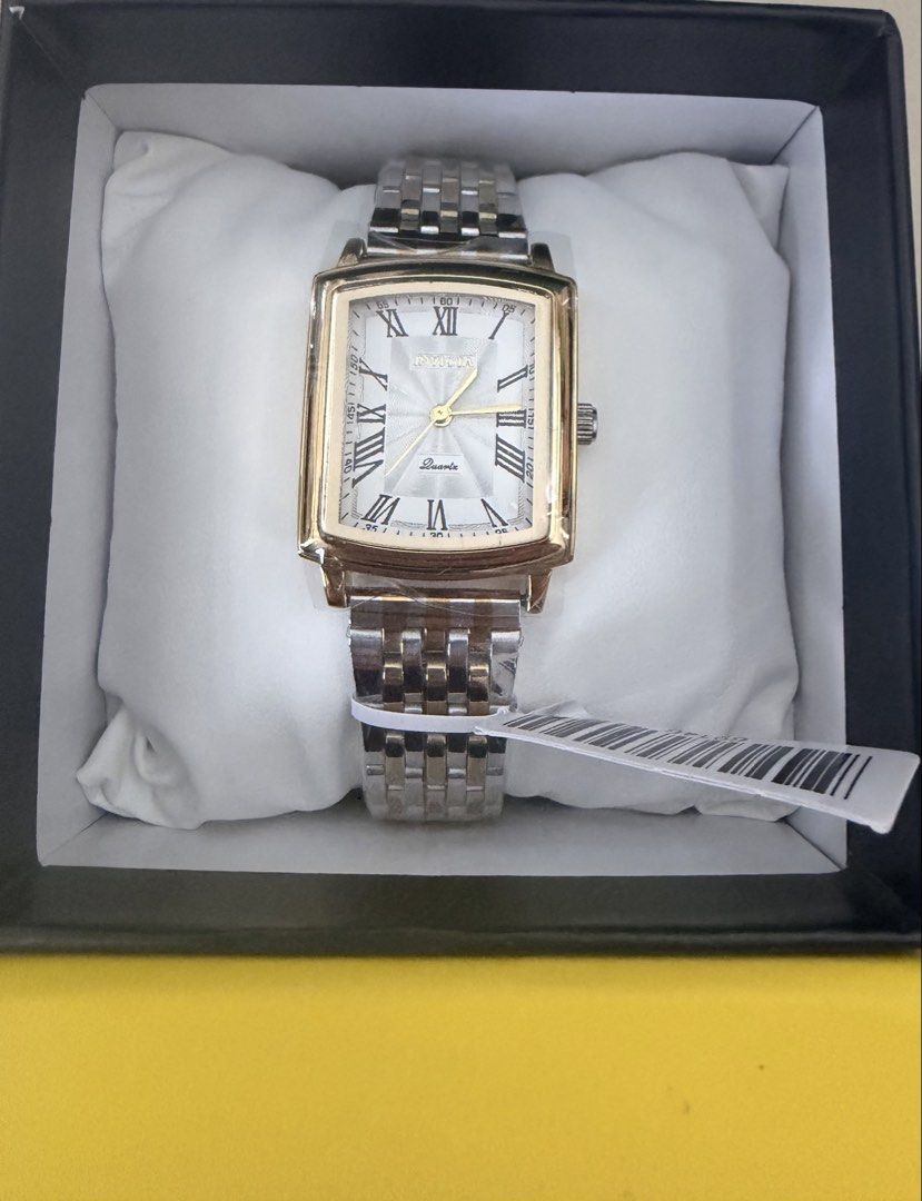 Invicta Celestial Ziya with Two-Tone Band (Category: Women's Watches) located in Pasig City. Submitted by jrrhs (Listing ID 1468452483, Image 1). Description: - Brand new with original yellow Invicta box and display pillow - Protective plastic wrapping still attached to the face and strap - Elegant rectangular gold-tone case - Classic white dial featuring Roman numerals - Stylish two-tone silver and gold stainless steel link bracelet - Reliable q
