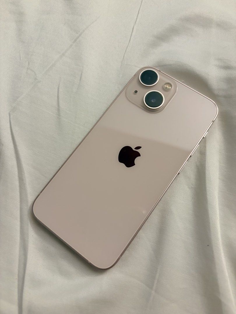 Iphone 13 Mini (Category: iPhone 13 Series) located in Lucena. Submitted by annsexclusive_wardrobe (Listing ID 1468454551, Image 2). Description: Bought in Qatar late 2021 or early 2022 Not damaged internally, no services done, no history of repair, updates only With minor dents and scratches from usage but nothing major to replace any parts of the original - Model: Apple iPhone 13 Mini - Color: Pink - Storage Capacity: 256GB - Condition: Well-ma