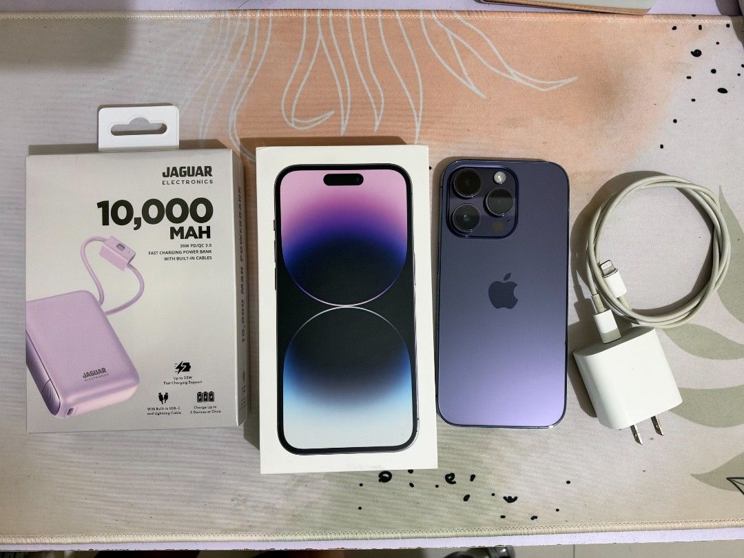iPhone 14 Pro 128GB Deep Purple Smart locked (Category: iPhone 14 Series) located in Muntinlupa City. Submitted by r0me5 (Listing ID 1468381210, Image 1). Description: No issues No history of repair No dents / scratches No longer under contract - can be carrier unlocked in Smart store 99% smoothness 79% Battery Health includes: -Smart Official Receipt -Original Apple charger+cable -Cases -Purple 10,000mah powerbank.