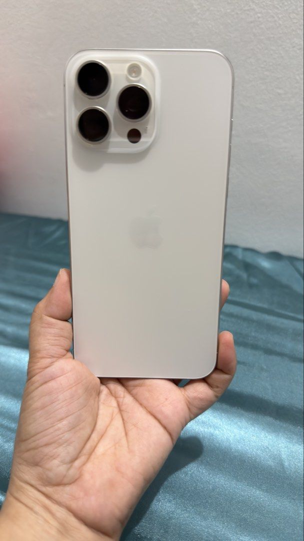 IPHONE 15 PRO MAX (Category: iPhone 15 Series) located in Manila. Submitted by prelovedbydarkangel (Listing ID 1468452339, Image 1). Description: For Sale Iphone 15 Pro Max 256gb White Titanium Smooth Condition No Fades, No Scratches, No Dents. * 74% Battery Health * NTC Approved * No Issue Complete Package: -Unit -Original Box Same Imei -Sim Ejector -Manuals -Apple Sticker -Charger RFS. Upgrade Meetup: Near UST Payment: Online Bank Transfer or G
