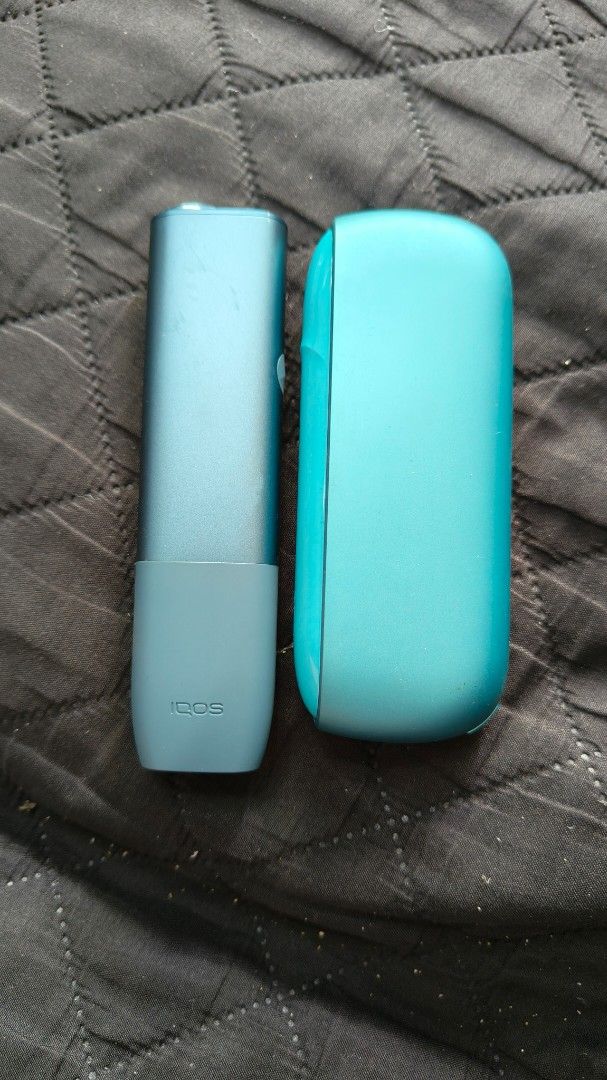 IQOS heated tobacco device teal (Category: Other Gadgets) located in Manila. Submitted by ryenne_leigh (Listing ID 1468321407, Image 1). Description: - Color: Teal - Includes: Holder and charger case - Condition: Fully functional, charges well, buttons click properly, regularly cleaned - Cosmetic: Minor signs of wear on the finish from normal handling - Feature: Compact size, perfect for daily carry.