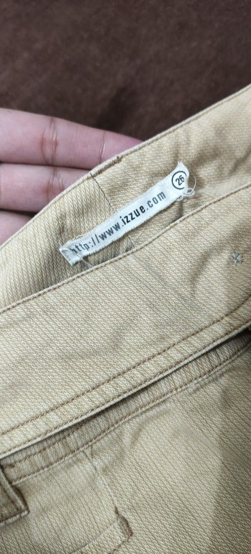 Izzue Beige Corduroy Pants Size 26 (Category: Jeans) located in Manila. Submitted by snz_shop (Listing ID 1468472666, Image 3). Description: - Brand: Izzue - Size: 26 - Color: Classic beige - Material: Textured corduroy fabric - Fit: Bootcut leg style - Closure: Zipper fly with dual button fastening - Details: Cute button accents near pockets and waistband, plus standard back pockets.