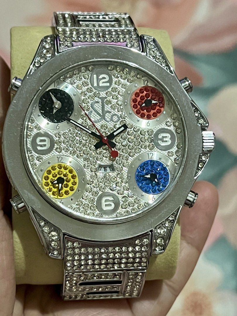 Jacob & Co Diamond Multi-Time Zone Watch (Category: Luxury Watches) located in Dagupan City. Submitted by casadebayongph (Listing ID 1468327812, Image 3). Description: - Brand: Jacob & Co - Design: Silver-tone case and bracelet completely covered in rhinestones - Dials: Main dial features pave crystals with silver numbers at 12, 3, 6, and 9 - Time Zones: Four separate sub-dials with black, red, yellow, and blue crystal backgrounds - Details: Text
