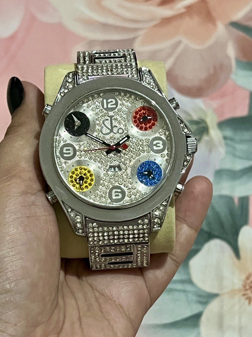 Jacob & Co Diamond Multi-Time Zone Watch (Category: Luxury Watches) located in Dagupan City. Submitted by casadebayongph (Listing ID 1468327812, Image 2). Description: - Brand: Jacob & Co - Design: Silver-tone case and bracelet completely covered in rhinestones - Dials: Main dial features pave crystals with silver numbers at 12, 3, 6, and 9 - Time Zones: Four separate sub-dials with black, red, yellow, and blue crystal backgrounds - Details: Text