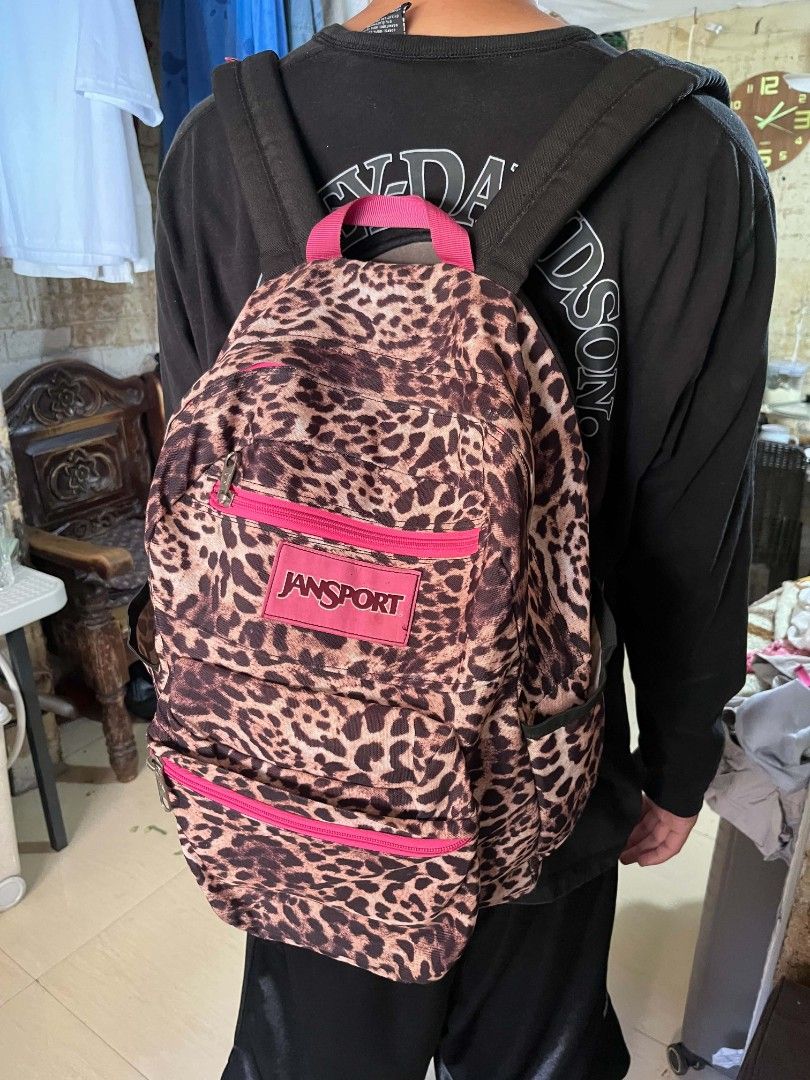 JanSport Leopard Print Backpack With Pink Accents (Category: Backpacks) located in Manila. Submitted by kaloyyyyyy (Listing ID 1468346540, Image 2). Description: - Classic JanSport backpack in a bold leopard print pattern - Vibrant bright pink zippers and matching JanSport logo patch - Multiple zipped compartments for easy organization - Padded shoulder straps for comfortable daily carry - Convenient top grab handle included.