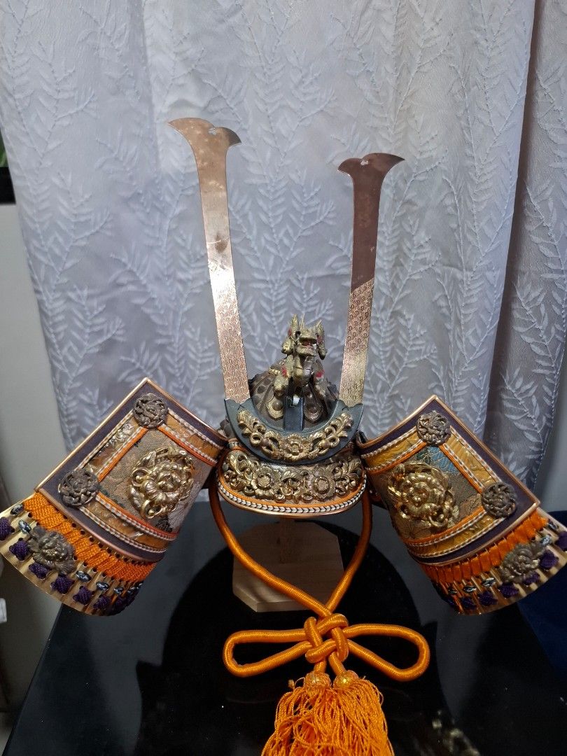 Japanese Samurai Warrior Doll in Glass Display Case (Category: Figurines & Statues) located in Real. Submitted by warmflower.d2b7ac (Listing ID 1468388991, Image 1). Description: - Authentic traditional Japanese samurai doll set - Encased in an elegant wooden glass display cabinet with ornate carvings - Complete with detailed full armor and miniature weapons - Features a scenic painted pine tree background panel - Excellent display piece for coll