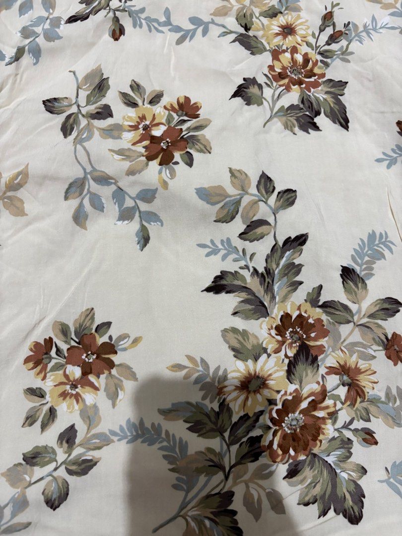 Jill Stuart Floral Long Skirt Size 2 (Category: Skirts) located in Manila. Submitted by van390867 (Listing ID 1468411078, Image 2). Description: - Brand: Jill Stuart Size 25 - Color/Pattern: Cream base with brown, green, and yellow floral print - Size: 2 (tag attached near waistband) - Closure: Side zipper - Details: Ruffled drape down the front, fully lined - Style: Cottagecore / vintage-inspired long skirt.