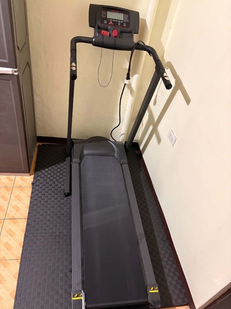 JK Exer 465 Foldable Treadmill Fitness Machine (Category: Cardio & Fitness Machines) located in Manila. Submitted by cyrenzjanu90396 (Listing ID 1468308344, Image 2). Description: - Model: JK Exer 465 treadmill - Space-saving fold-up design for easy home storage - Digital display console to track your workouts - Emergency stop key with a red safety cord included - Built-in handle controls for easy adjustments - Sturdy black frame with user-friend