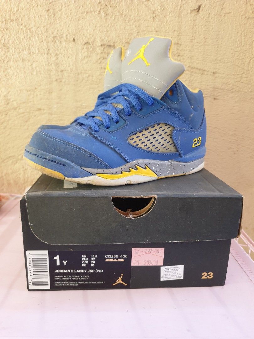 Jordan 5 Laney JSP (PS) (Category: Babies & Kids Fashion) located in Las Pinas. Submitted by anggesmart (Listing ID 1468382672, Image 1). Description: - Model: Air Jordan 5 Retro 'Laney' - Size: Kids / Preschool 1Y - Colorway: Blue nubuck upper with yellow and grey details - Features: Embroidered '23' on the heel and iconic speckled midsole - Condition: Normal wear on uppers and soles - Packaging: Includes original box with retail stickers attach