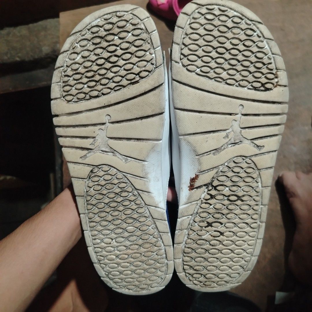 Jordan Hydro Slides White Black Blue (Category: Slippers & Slides) located in Manila. Submitted by boriz_goodman (Listing ID 1468463003, Image 3). Description: - Brand: Jordan - Color: White and blue with classic Jumpman logo - Features: Adjustable strap and textured footbed for grip and comfort - Condition: Shows normal wear with dirt on the tread and minor side glue separation near the blue accent - Status: Still very wearable for casual, every