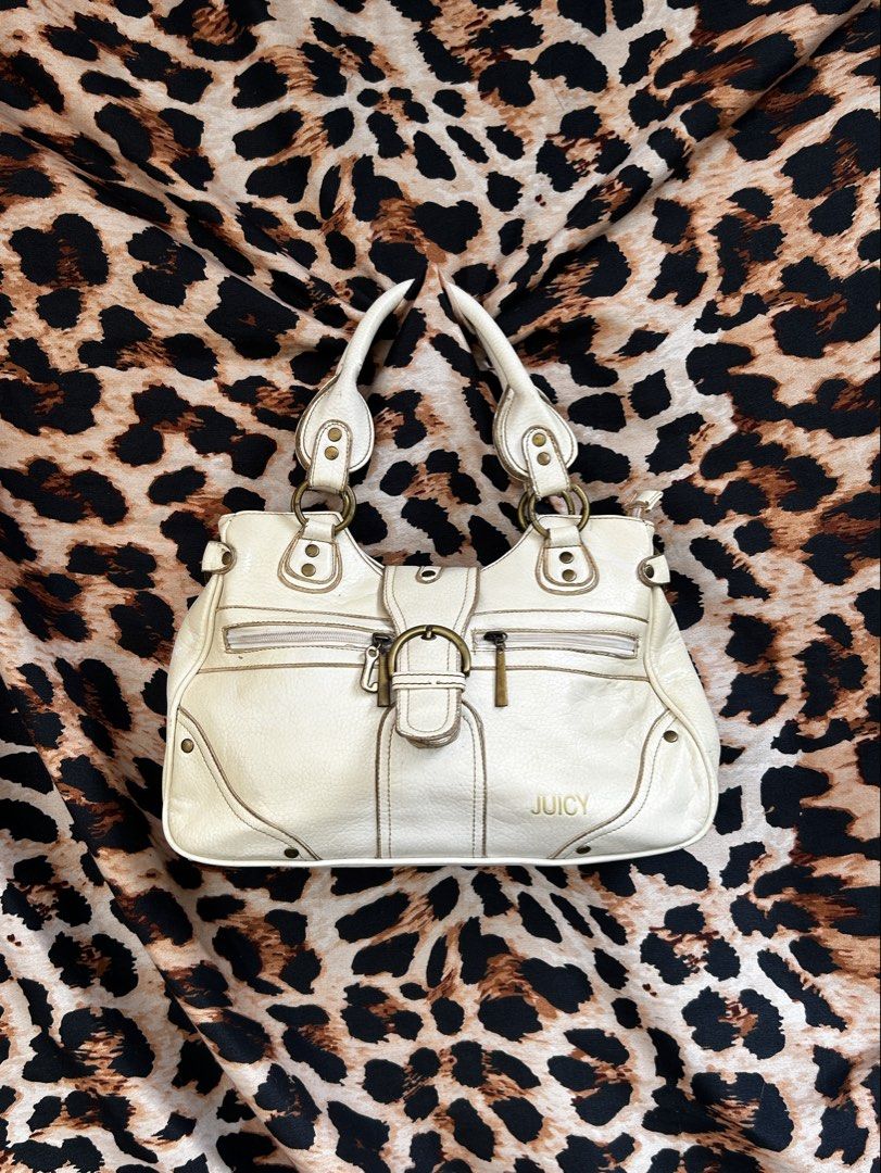 Juicy Couture white shoulder bag with gold hardware (Category: Shoulder Bags) located in Los Banos. Submitted by samsukehiro (Listing ID 1468381601, Image 1). Description: - Brand: Juicy Couture (ntguarntd) - Color: White faux leather with metallic gold logo lettering - Hardware: Antique brass tone with signature 'J' zipper pull - Handles: Dual top handles for easy shoulder wear - Pockets: Front zip pockets, exterior back zip pocket, and multiple