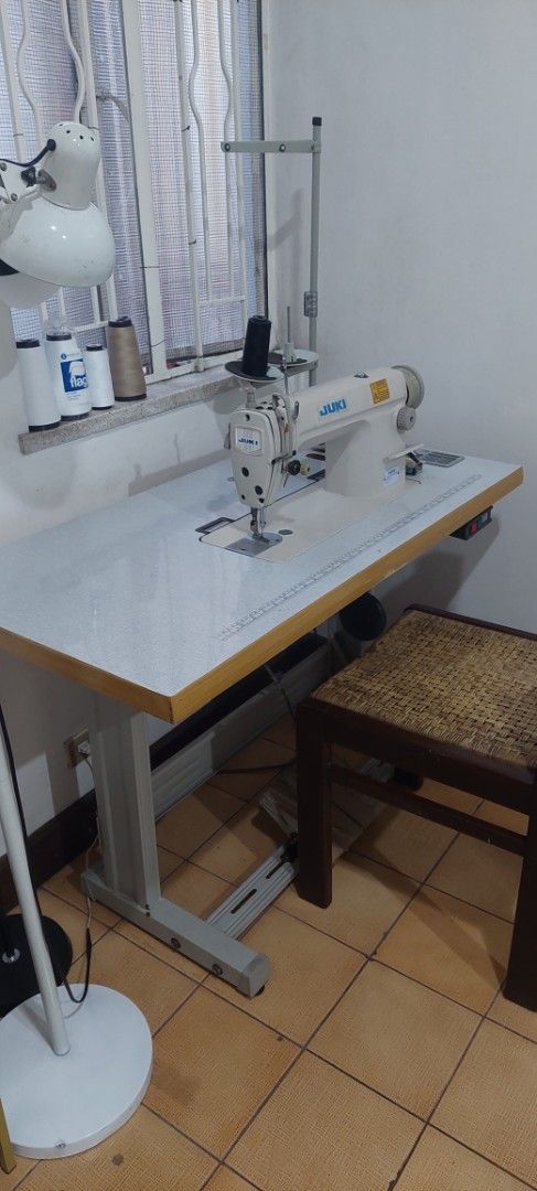 Juki Industrial Sewing Machine with Table (Category: Industrial Equipment) located in Manila. Submitted by mcangwong80885 (Listing ID 1468362816, Image 3). Description: - Authentic Juki industrial sewing machine - Built-in metal table stand - foot pedal underneath - Includes a multi-spool thread stand - Ideal for heavy-duty sewing, thick fabrics, and professional tailoring.