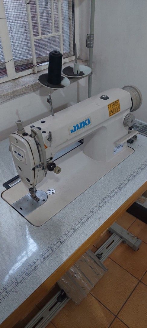Juki Industrial Sewing Machine with Table (Category: Industrial Equipment) located in Manila. Submitted by mcangwong80885 (Listing ID 1468362816, Image 1). Description: - Authentic Juki industrial sewing machine - Built-in metal table stand - foot pedal underneath - Includes a multi-spool thread stand - Ideal for heavy-duty sewing, thick fabrics, and professional tailoring.