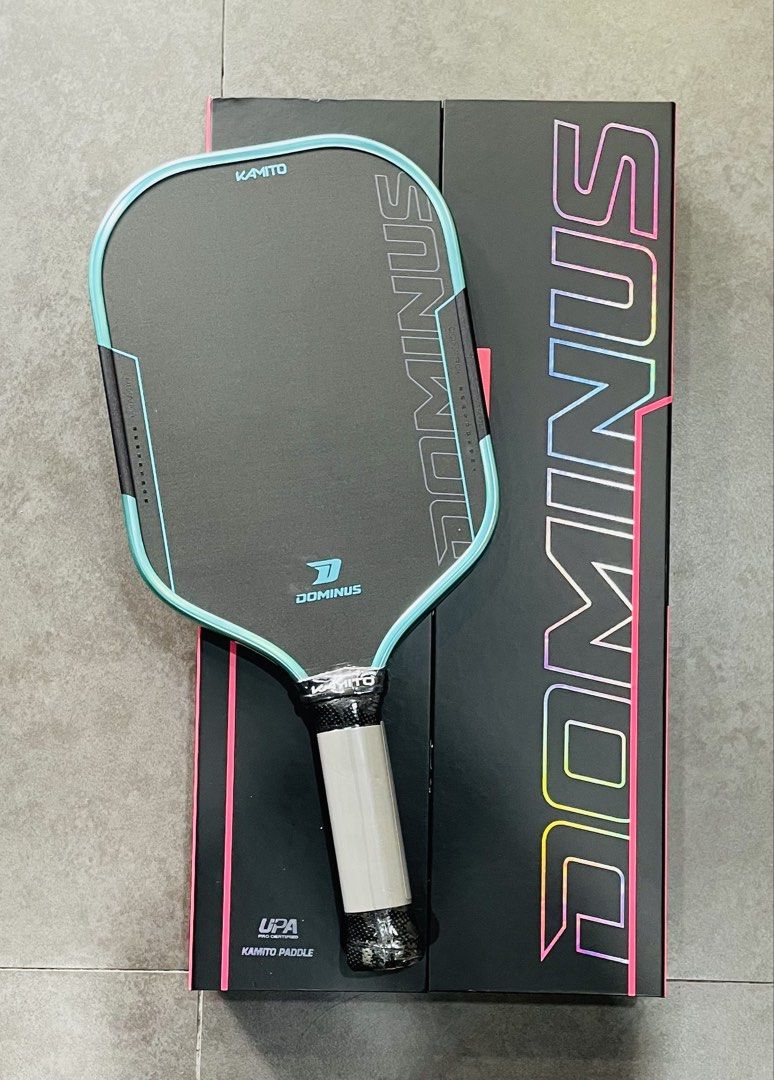 Kamito Dominus Pickleball Paddle with Box (Category: Racket and Ball Sports) located in Manila. Submitted by cairosebastian (Listing ID 1468303704, Image 1). Description: - Brand: Kamito Dominus Pickleball Paddle (UPA Pro Certified) - Condition: Brand new, grip still wrapped in plastic - Face: Black carbon fiber with a colorful edge guard and striking branding - Performance: Excellent control paddle, ideal for players looking to level up their ga