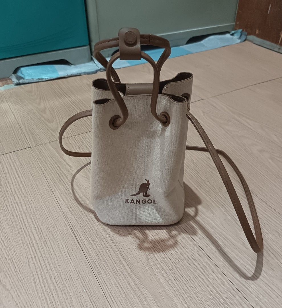 KANGOL DUO CANVAS BUCKET BAG (Category: Shoulder Bags) located in Cavite. Submitted by marcuz.lifestyle (Listing ID 1468311482, Image 1). Description: WIDTH:5.5" HEIGHT: 8" DEPTH:5.5" VERRYGOOD CONDITION NO ISSUE NEED WASH ONLY COLOR RATE:9.5/10 MOP:GCASH DELIVERY COURIER:JNT LOCATION:IMUS CAVITE.