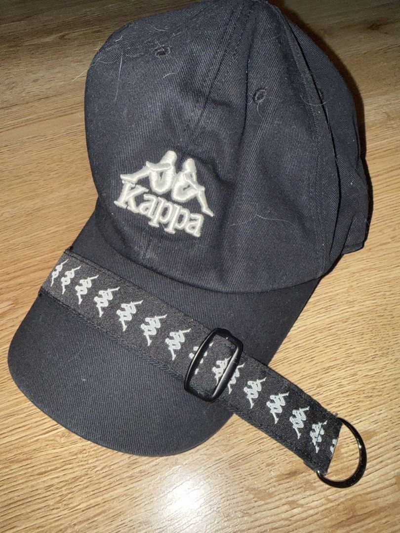 KAPPA VINTAGE LOGO STRAP CAP – BLACK (Category: Caps & Hats) located in Las Pinas. Submitted by coolthreadz (Listing ID 1468401880, Image 1). Description: 🧢 KAPPA VINTAGE LOGO STRAP CAP – BLACK 🏷️ Brand: Kappa 🧢 Model: Kappa Logo Strap Baseball Cap 🎨 Color: Black / White 📏 Size: Free Size (Adjustable) 🧵 Material: 100% Cotton (as indicated on tag) 🌏 Made in: Korea 🔖 Design: Embroidered Kappa Logo with Branded Strap Detail ✨ Condition: Good