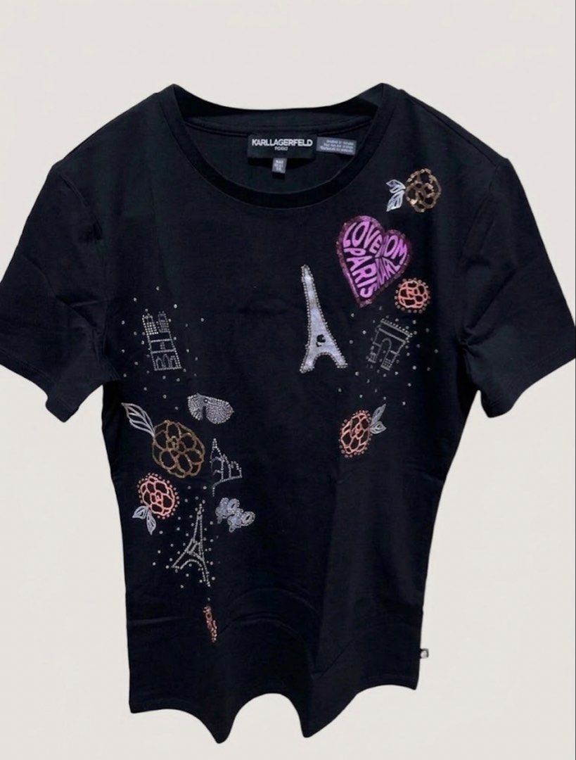 Karl shirt (Category: Luxury Apparel) located in Lucena. Submitted by classy_chanel (Listing ID 1468312612, Image 1). Description: Brand: Karl Lagerfeld Paris Color: Black Style: Embellished Graphic Tee Sleeve: Short Sleeve Condition: Excellent / New.