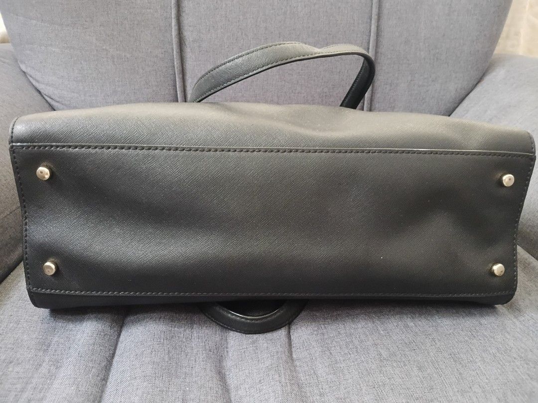 Kate Spade Black Tote Bag (Category: Tote Bags) located in Binangonan. Submitted by chingtp (Listing ID 1468288880, Image 3). Description: - Authentic Kate Spade black tote bag - Durable Saffiano leather with gold-tone hardware - Secure zip-top closure and double top handles - Protective metal feet on the bottom - Spacious black and white striped fabric interior with pockets - Perfect for work, school, or everyday essentials.