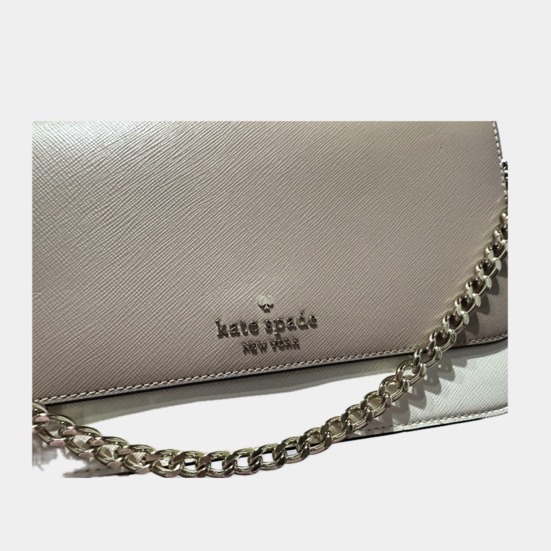 Kate Spade madison flap crossbody bag (Category: Cross-body Bags) located in Paranaque City. Submitted by annvzsn (Listing ID 1468498949, Image 2). Description: Color: beige/white/black Size: medium Material: leather Bought in: US (physical store) Condition: like new Details: - Ideal for both daytime and evening use - Genuine saffiano leather - Gold chain detail - Detachable strap for versatile wear - Magnetic snap closure - Interior zippered poc