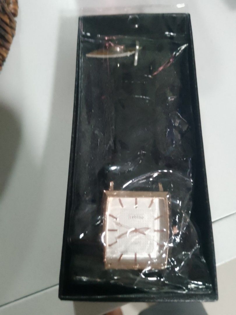 Kebino Square Quartz Watch Rose Gold (Category: Men's Watches) located in Manila. Submitted by warmtiger.a2c491 (Listing ID 1468362162, Image 2). Description: - Brand: Kebino Quartz Watch - Color: Rose Gold - Design: Square dial with minimalist hour markers - Condition: Brand new, never worn, still wrapped in protective plastic - Packaging: Comes in a sleek black presentation box - Perfect for: Everyday wear or as a ready-to-give gift.