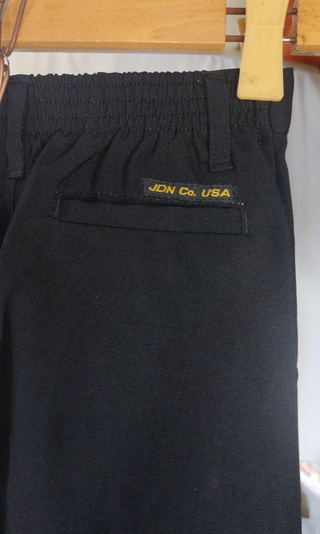 Kids black slacks (Category: Babies & Kids Fashion) located in Quezon City. Submitted by plantcorner (Listing ID 1468331384, Image 2). Description: Waist 22 Haba 25 inches Lalamove only Wash nalang po matagal nakaimbak Good condition Pin 📍 21 col s e tolentino qc.