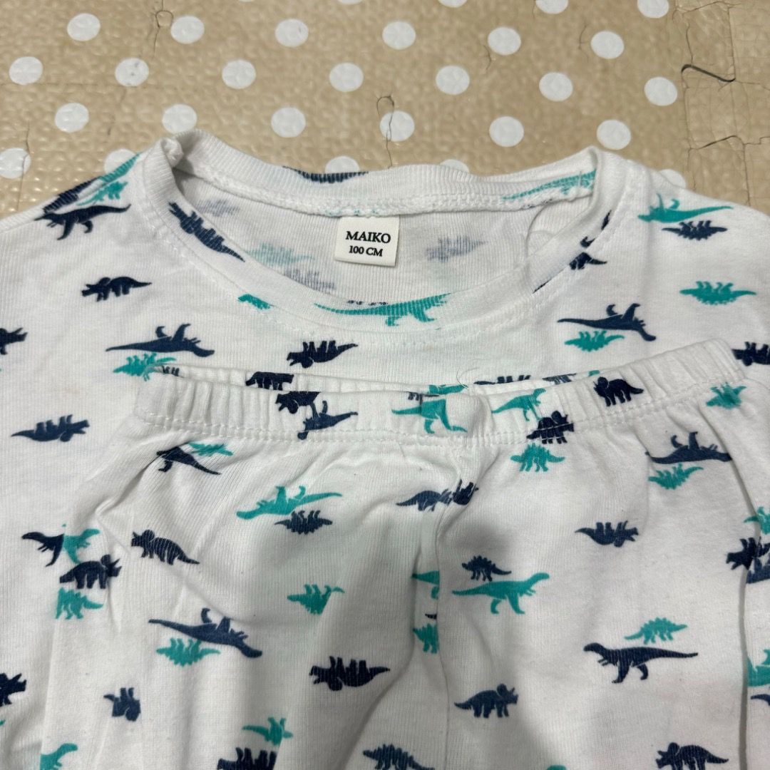 Kids dinosaur long sleeve pajama set (Category: Babies & Kids Fashion) located in Manila. Submitted by louvemaria (Listing ID 1468410694, Image 2). Description: - Bought in Vietnam - Like new - EUC - Fits 3-4T - Item: Kids long sleeve pajama set (Top and pants included) - Design: White base with blue and green dinosaur prints - Material: Soft, breathable cotton for ultimate comfort - Features: Comfortable fitted cuffs on wrists and ankles - Condi