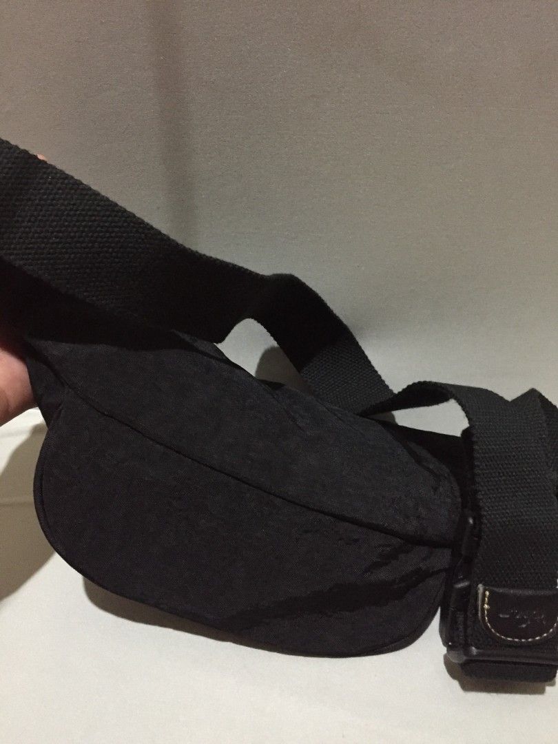 *Kipling Fanny Pack / Belt Bag - Black* (Category: Belt bags, Clutches and Pouches) located in Bulacan. Submitted by assorted.items (Listing ID 1468416940, Image 2). Description: *Kipling Fanny Pack / Belt Bag - Black* Brand: Kipling Style: Fanny pack / Crossbody / Belt bag Color: Black with gold stitching *Details from photos:* - Heavy-duty silver zippers - working (see pic 1) - Clean interior, beige lining, no major stains (pic 2) - Adjustable 