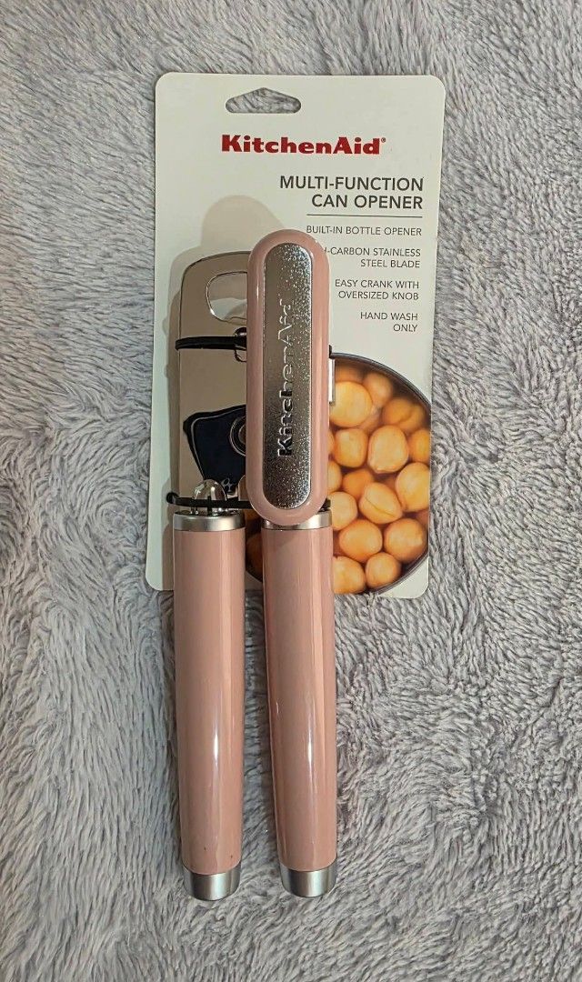 KitchenAid Multi-Function Can Opener Pink (Category: Knives & Chopping Boards) located in Pateros City. Submitted by armcandystuff (Listing ID 1468312476, Image 1). Description: - Authentic KitchenAid multi-function can opener in a gorgeous pink color - Heavy-duty stainless steel blade for effortless and smooth cutting - Oversized crank knob designed for easy turning and comfortable grip - Built-in bottle opener conveniently located on the head -