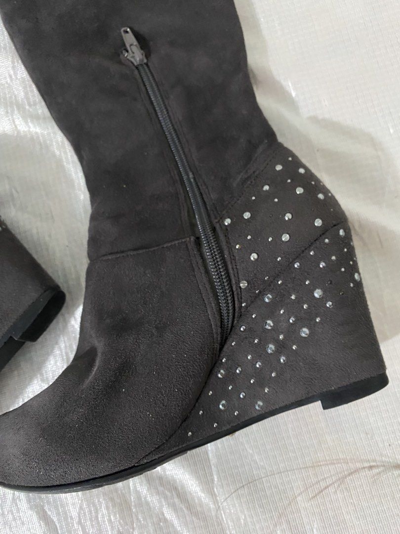 Knee-High / Over-the-Knee Wedge Boots (Category: Boots) located in Baguio. Submitted by sollunathrift13 (Listing ID 1468446513, Image 2). Description: size:36.5/37 Heel Style: Covered wedge heel with rhinestone/stud embellishments around the heel and back counter area. Closure: Side zipper closure for easy wear. Toe Shape: Rounded toe. Outsole: Black rubber sole with textured anti-slip traction pattern. Origin/Label: Japanese care label attached 