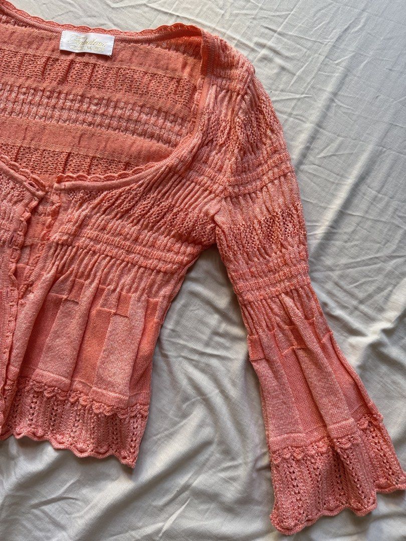 Knit Cardigan Peach Orange (Category: Coats, Jackets and Outerwear) located in Mandaluyong City. Submitted by uol77 (Listing ID 1468331553, Image 2). Description: - Brand: Fabulous Cecil McBee - Color/Style: Peach lightweight knit cardigan with subtle shimmer threads - Design: Square neckline and button-front closure - Sleeves: Long flared sleeves - Details: Textured pattern with delicate scalloped hems.