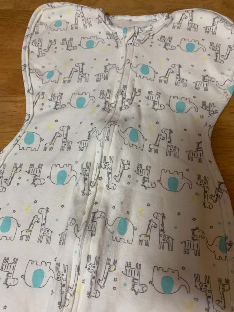 Kolaco White Elephant Swaddle Sleeping Bag Transitional Two Way Zip (Category: Cots & Cribs) located in Cainta. Submitted by akosijoan (Listing ID 1468390834, Image 2). Description: - Cute elephant, giraffe, and yellow star print on a white base with blue accents - Super convenient two-way zipper for hassle-free midnight diaper changes - Soft and breathable cotton fabric keeps newborns cozy and warm all night - Designed for safe transitions and p