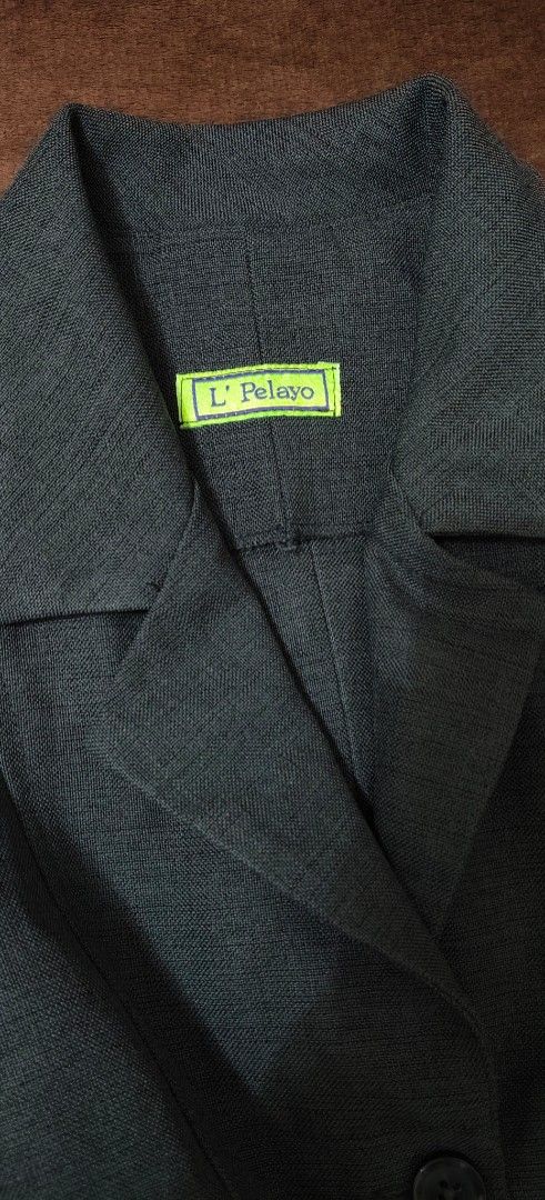 L' Pelayo grey blazer jacket size medium (Category: Coats, Jackets and Outerwear) located in Manila. Submitted by snz_shop (Listing ID 1468472587, Image 2). Description: - Brand: L' Pelayo - Color: Versatile grey (goes with everything) - Closure: Three-button front with classic lapel collar - Design: Structured shoulders and seam detailing across the body - Pockets: Two functional front pockets - Lining: Fully lined inside - Style: Ideal for offi
