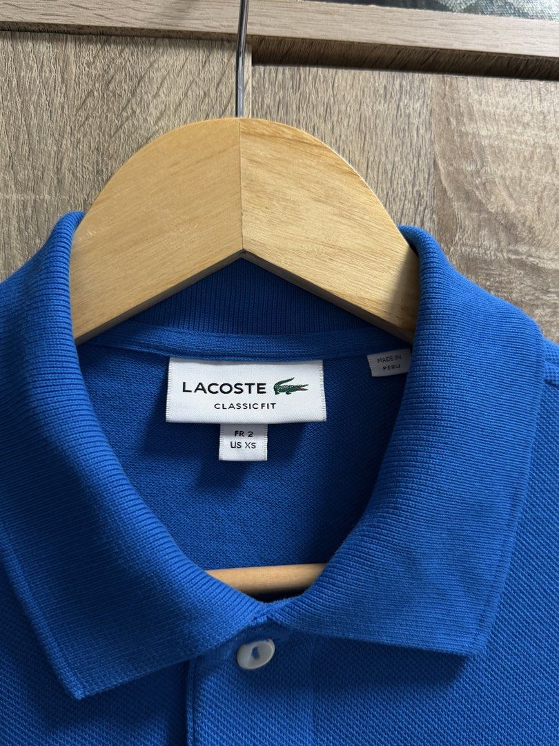 Lacoste Classic Fit Polo Shirt (Category: Tshirts & Polo Shirts ) located in Imus. Submitted by rckrmns (Listing ID 1468356006, Image 3). Description: Lacoste Classic Fit Polo Shirt Size XS W- 18.5 L- 26 Good as New .