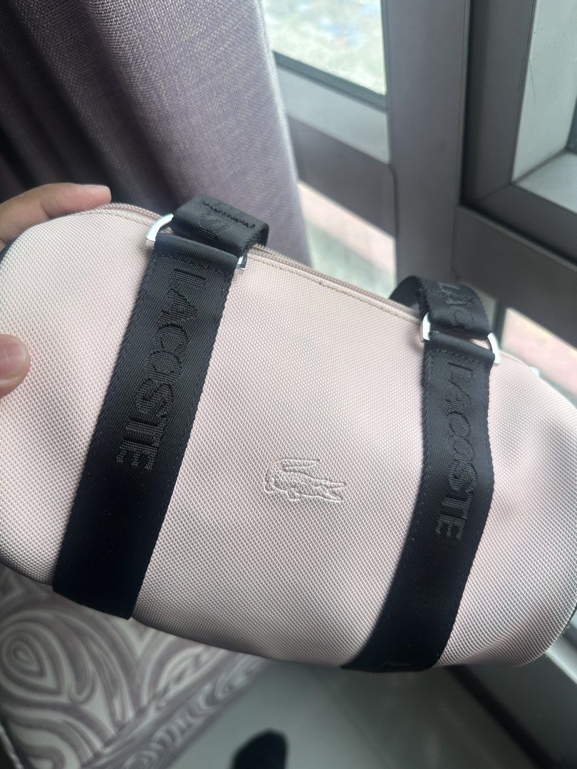 Lacoste Cylindrical Bag (Category: Purses & Pouches) located in Mandaluyong City. Submitted by fourleafcloverrrr (Listing ID 1468292724, Image 3). Description: Lacoste Cylindrical/ Barrel Bag in prestige condition Issue: Color transfer Legit.