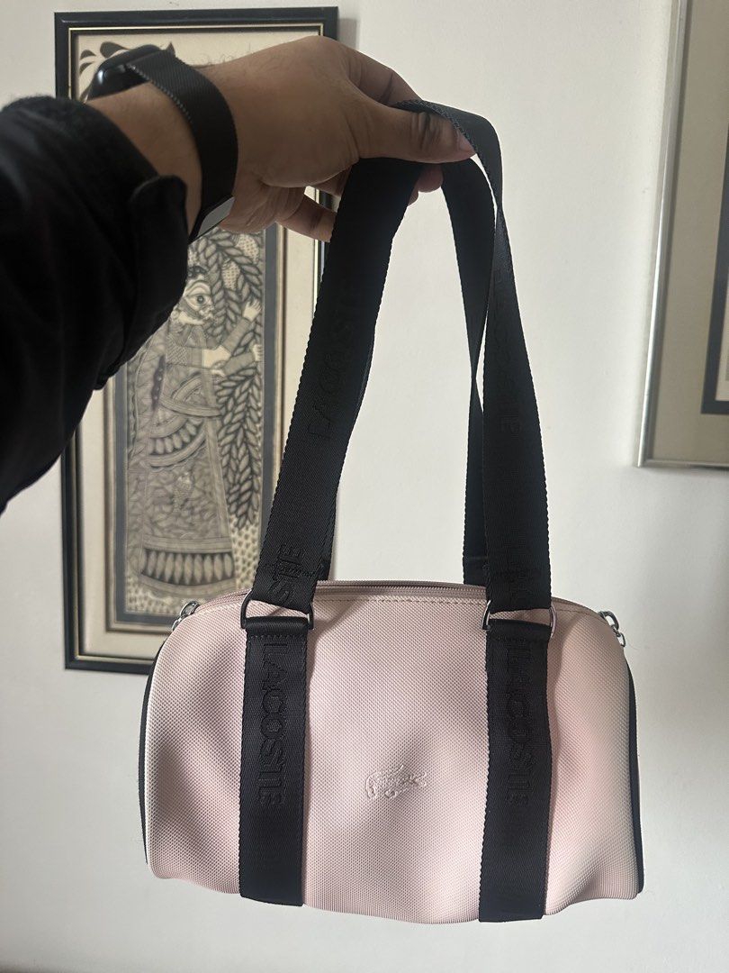 Lacoste Cylindrical Bag (Category: Purses & Pouches) located in Mandaluyong City. Submitted by fourleafcloverrrr (Listing ID 1468292724, Image 1). Description: Lacoste Cylindrical/ Barrel Bag in prestige condition Issue: Color transfer Legit.