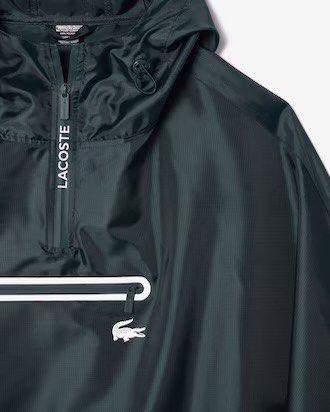 Lacoste Hooded Waterproof Poncho Raincoat (Category: Coats, Jackets and Outerwear) located in Manila. Submitted by jeromepsg12 (Listing ID 1468298402, Image 2). Description: - Brand: Lacoste - Color: Dark green - Condition: Brand new, unused (still in pouch) - Features: Waterproof, half-zip front, hood with drawstrings, and front pocket - Branding: Classic crocodile logo on front, large Lacoste branding on the back - Portability: Lightweight and 