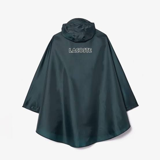 Lacoste Hooded Waterproof Poncho Raincoat (Category: Coats, Jackets and Outerwear) located in Manila. Submitted by jeromepsg12 (Listing ID 1468298402, Image 3). Description: - Brand: Lacoste - Color: Dark green - Condition: Brand new, unused (still in pouch) - Features: Waterproof, half-zip front, hood with drawstrings, and front pocket - Branding: Classic crocodile logo on front, large Lacoste branding on the back - Portability: Lightweight and 