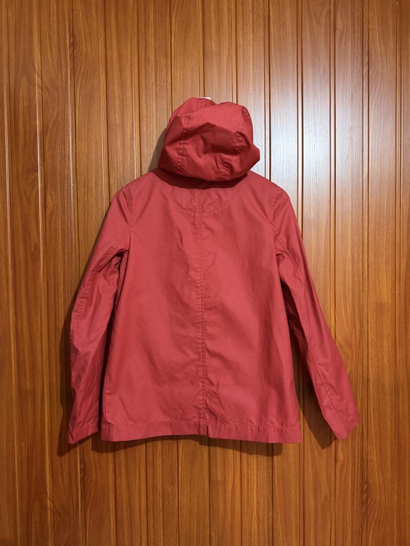 Lacoste Live Red Hooded Water Proof jacket (Category: Coats, Jackets and Outerwear) located in Manila. Submitted by tlfph (Listing ID 1468296132, Image 3). Description: - Brand: Lacoste Live - Color: Vibrant red with contrasting bright yellow buttons - Size: Medium (M) - Material: 85% cotton, 15% polyurethane - Features: Attached hood, front button closure, and front pocket flaps - Branding: Iconic crocodile logo embroidered above the right pocke