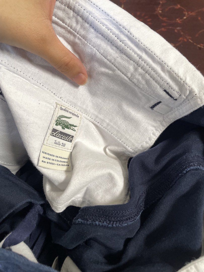 Lacoste Navy Blue Cargo Pants (Category: Joggers) located in Manila. Submitted by barrybalenshagga (Listing ID 1468355042, Image 2). Description: size 36-38 - Brand: Lacoste - Color: Navy Blue - Material: Durable, high-quality cotton - Fit: Classic straight leg cut - Features: Practical side cargo pockets and back pockets with button flaps - Branding: Iconic embroidered green crocodile logo on the back right pocket - Style: Versatile and comforta