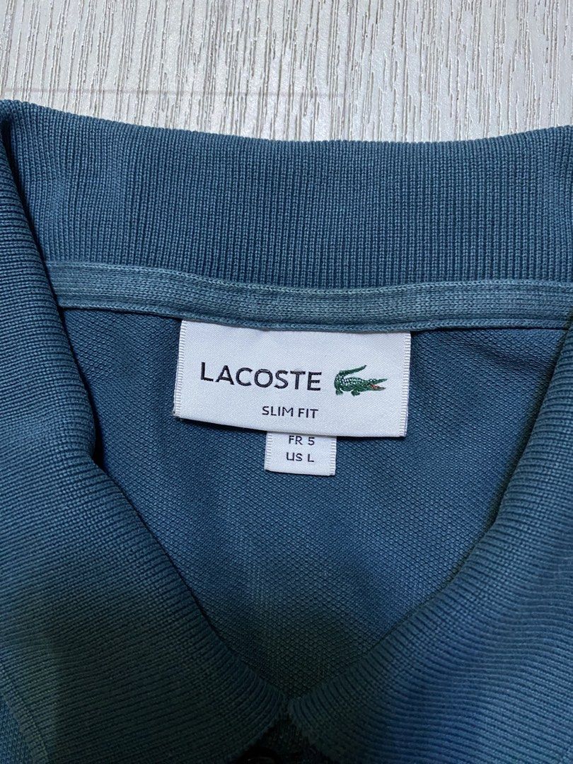 Lacoste Slim Fit (Category: Tshirts & Polo Shirts ) located in Pasig City. Submitted by terrencec34805 (Listing ID 1468473956, Image 2). Description: Lacoste Slim fit polo shirt In good condition Size:Large Width:19 Length:28.