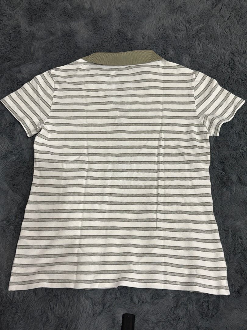 Lacoste Striped Polo Shirt Size 38 (Category: Tshirts & Polo Shirts ) located in Antipolo. Submitted by dddeclutter (Listing ID 1468357227, Image 2). Description: - Brand: Lacoste - Style: Striped short sleeve polo shirt - Color: White and olive green - Size: 38 (fits S to M).