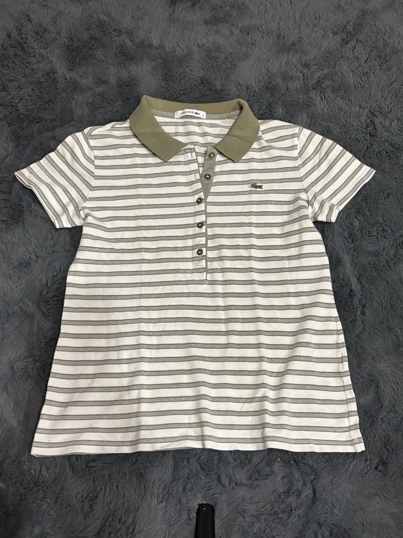 Lacoste Striped Polo Shirt Size 38 (Category: Tshirts & Polo Shirts ) located in Antipolo. Submitted by dddeclutter (Listing ID 1468357227, Image 1). Description: - Brand: Lacoste - Style: Striped short sleeve polo shirt - Color: White and olive green - Size: 38 (fits S to M).