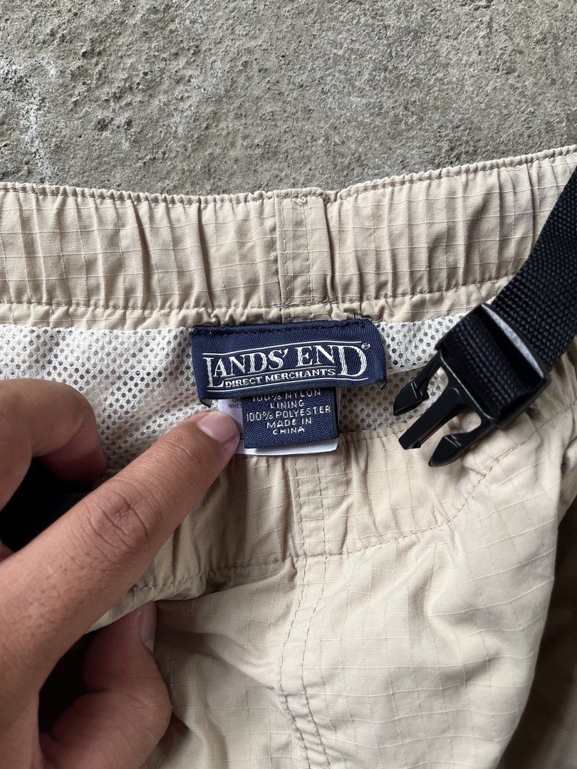 Lands' End Nylon Cargo Shorts Beige Size M (Category: Shorts) located in Calabanga. Submitted by jijithriftcamarinessur (Listing ID 1468314836, Image 2). Description: - Brand: Lands' End - Color: Classic Beige - Material: Durable ripstop nylon fabric - Fit: Elastic waistband with built-in black buckle belt - Storage: Multiple side cargo pockets and secure zippered back pockets - Comfort: Breathable mesh lining inside - Condition: Excellent pre-lo
